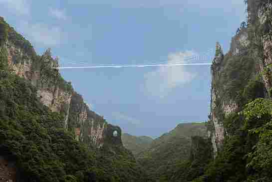 The World’s Tallest and Longest Glass-Bottom Bridge Will Open in China